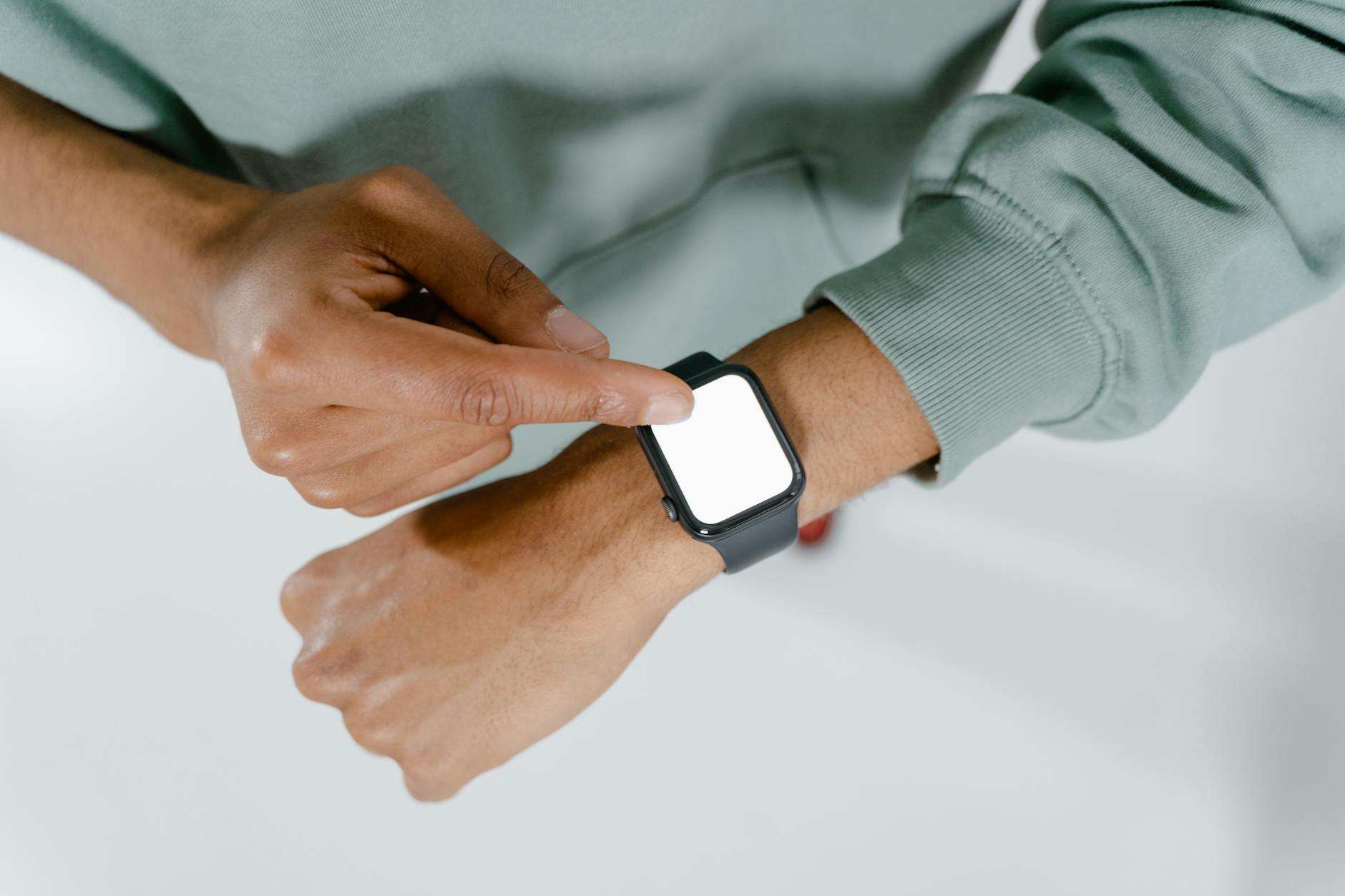 A person wearing a smartwatch, representing the personalization of healthcare through AI-powered wearables