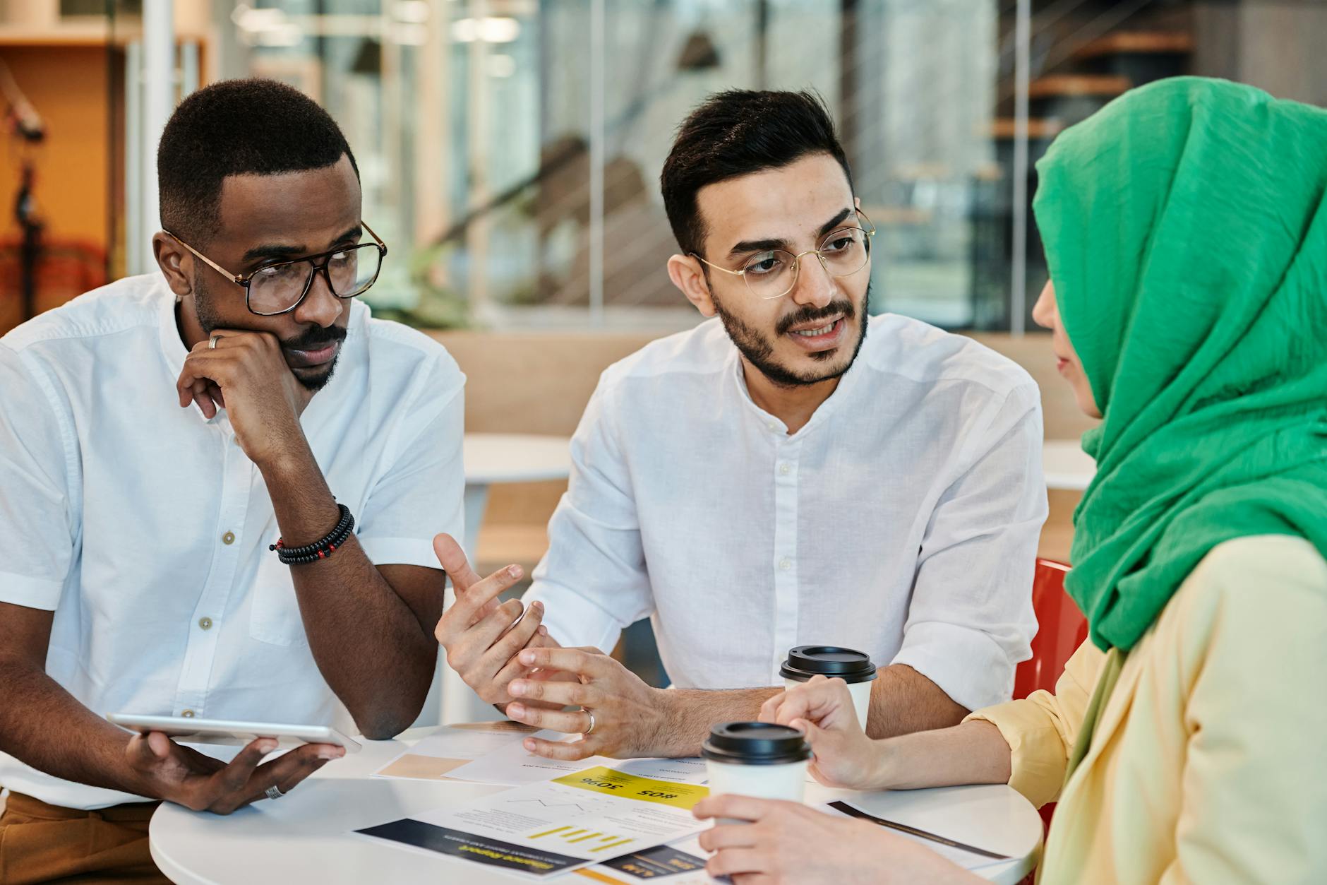 A diverse group of people from different backgrounds engaged in a thoughtful discussion, representing the need for inclusive global dialogue on gene editing ethics.