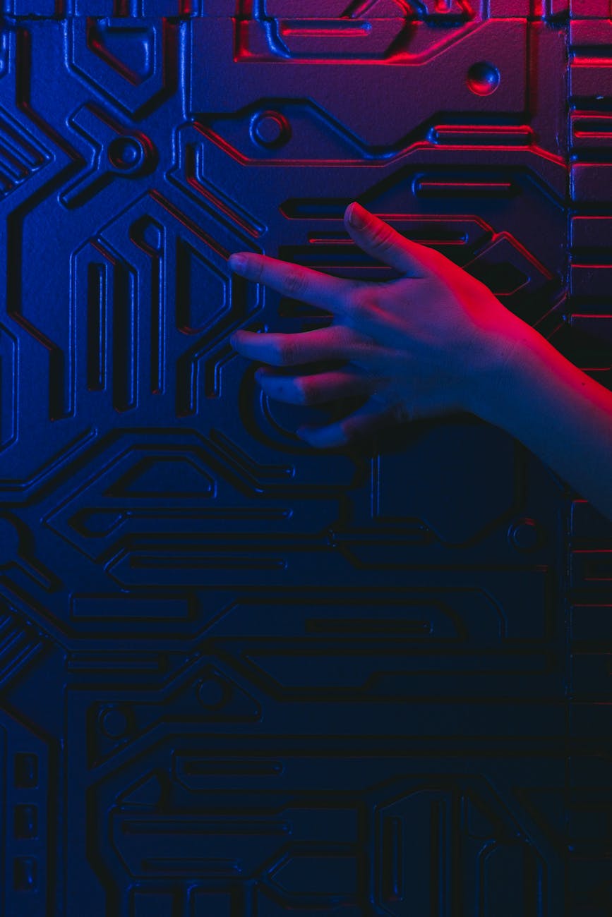 A stylized image of a human hand interacting with a complex quantum circuit, representing the human element in guiding ethical AI development.