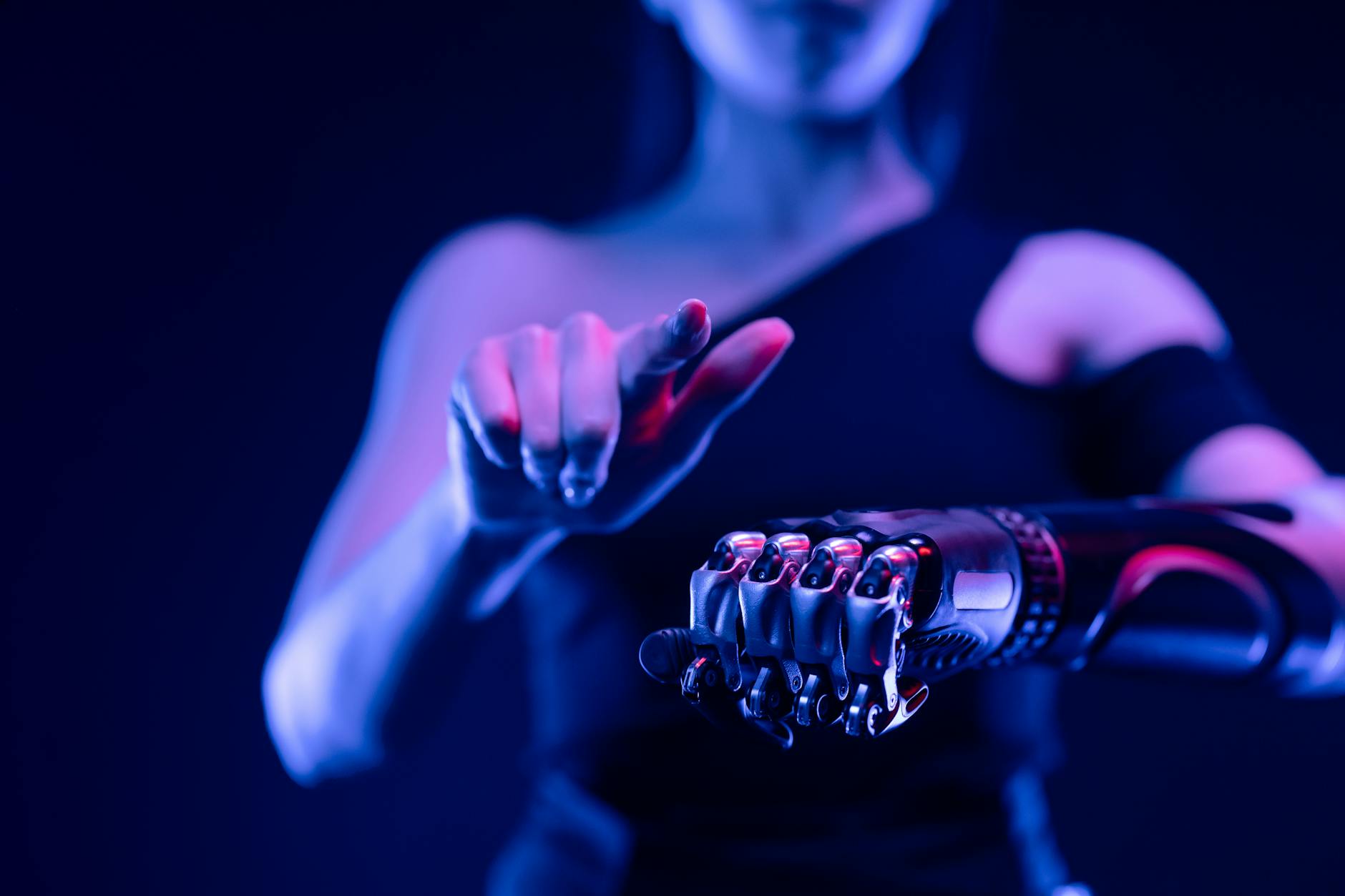 A conceptual image of human-robot collaboration in a smart factory, where a human worker seamlessly interacts with an autonomous robotic arm, both augmented by holographic data overlays, emphasizing safety and efficiency.