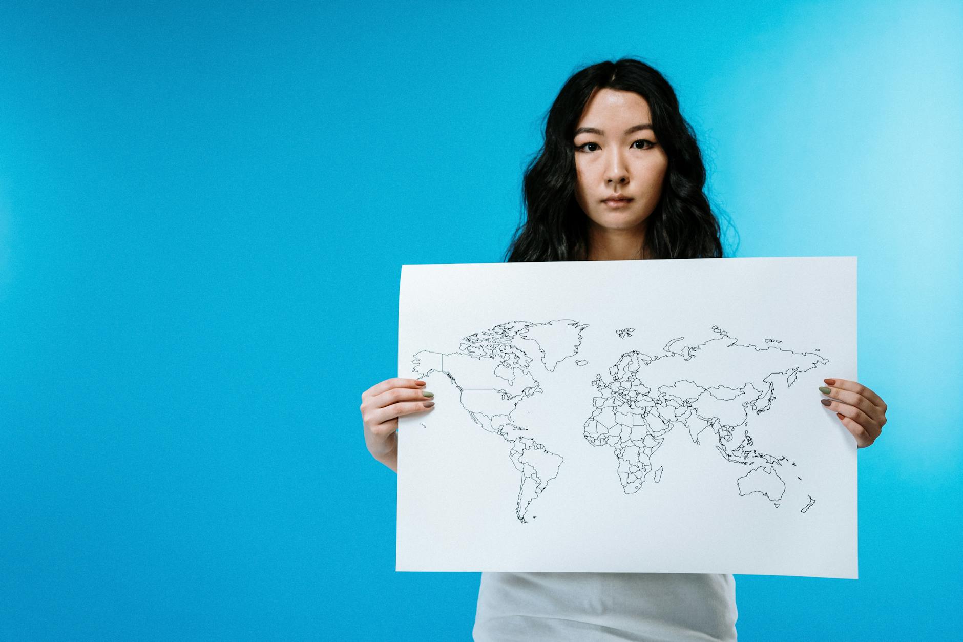 A world map subtly overlaid with interconnected nodes, signifying the global impact and interconnectedness of OOC technology in revolutionizing healthcare worldwide.