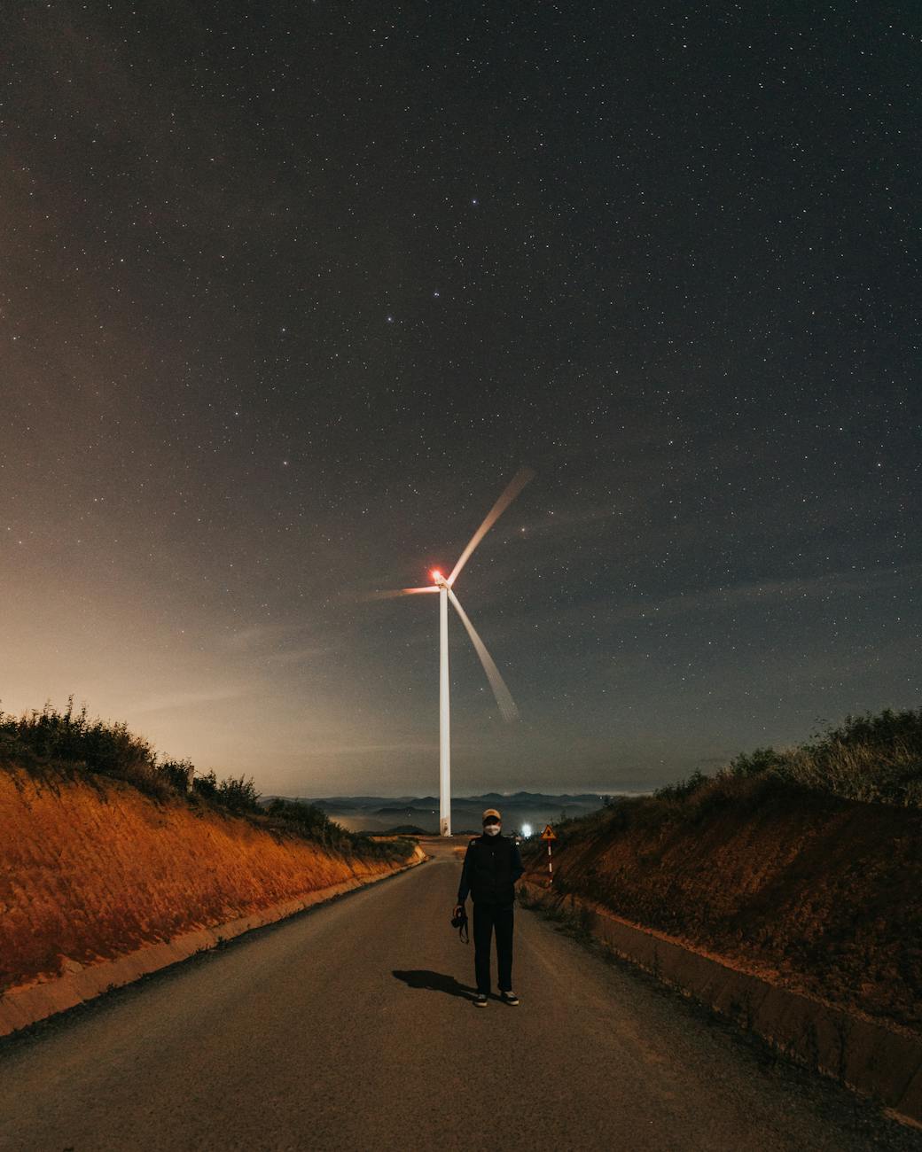 A futuristic, sleek SMR facility glowing with clean energy, surrounded by a serene, natural landscape under a starry sky.