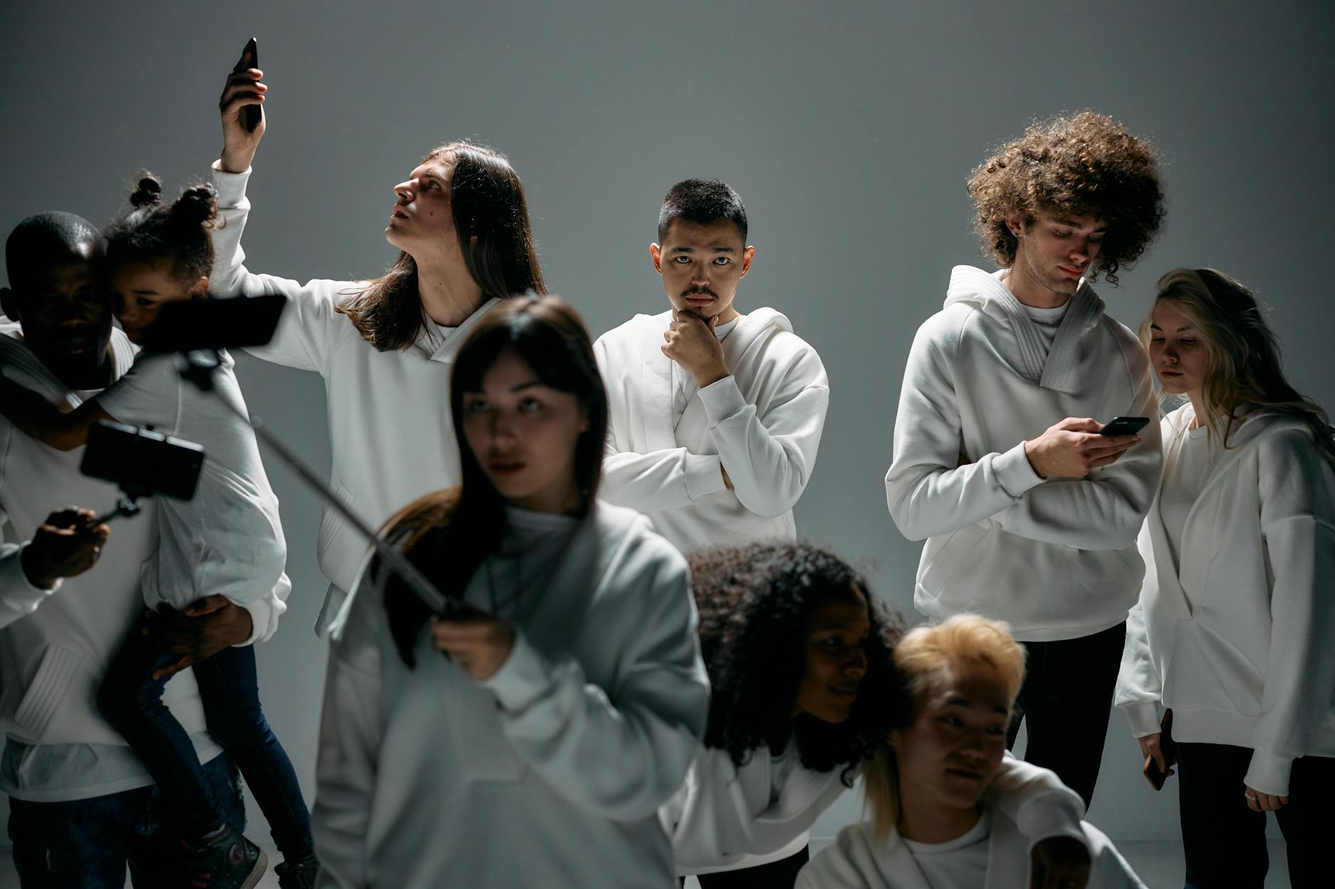 A diverse group of individuals engaging with various neurotech devices in everyday settings: one person meditating with a sleek headband, another playing a game with a headset, and someone else interacting with a smart home device via thought.