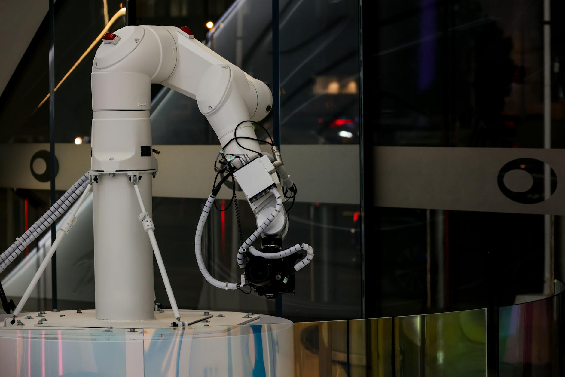 A futuristic laboratory scene with AI interfaces displaying complex biological data alongside robotic arms performing automated experiments.