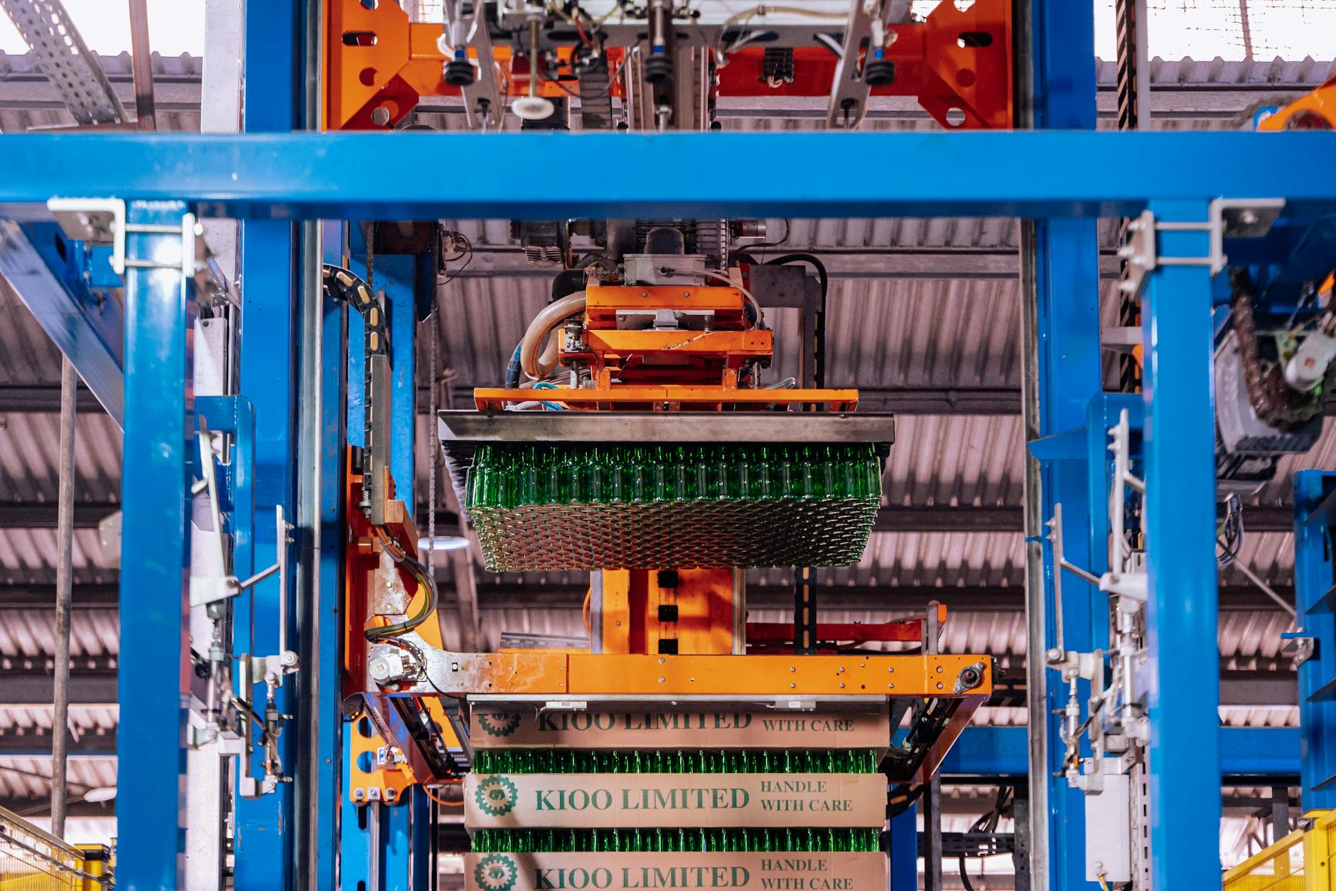 A highly automated, sterile biomanufacturing facility with robotic arms handling bioreactors and gene therapy vials, representing scalable and high-precision production.