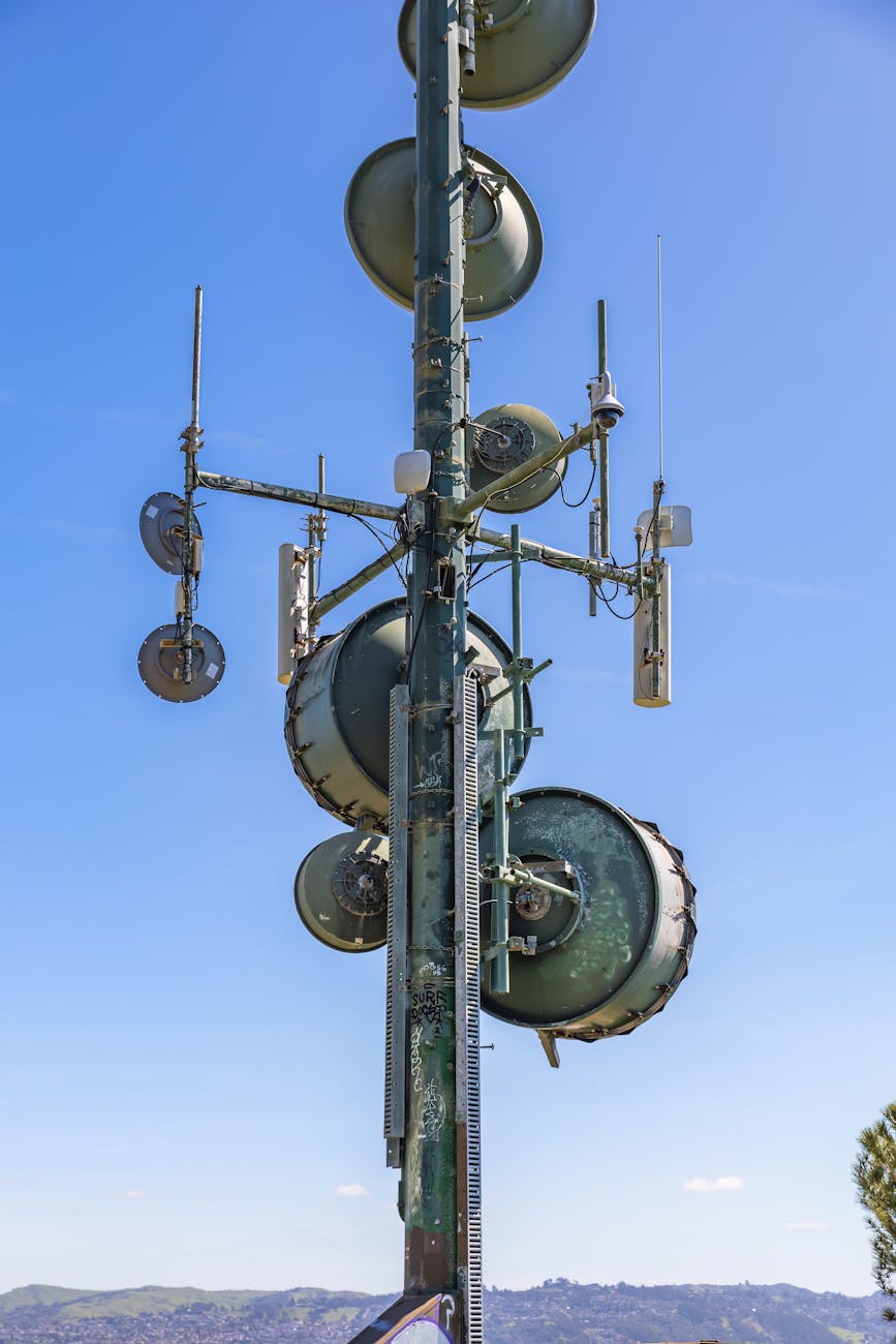 A split image showing on one side, a classical satellite communication signal being intercepted, and on the other side, a secure quantum communication beam passing through unaffected.