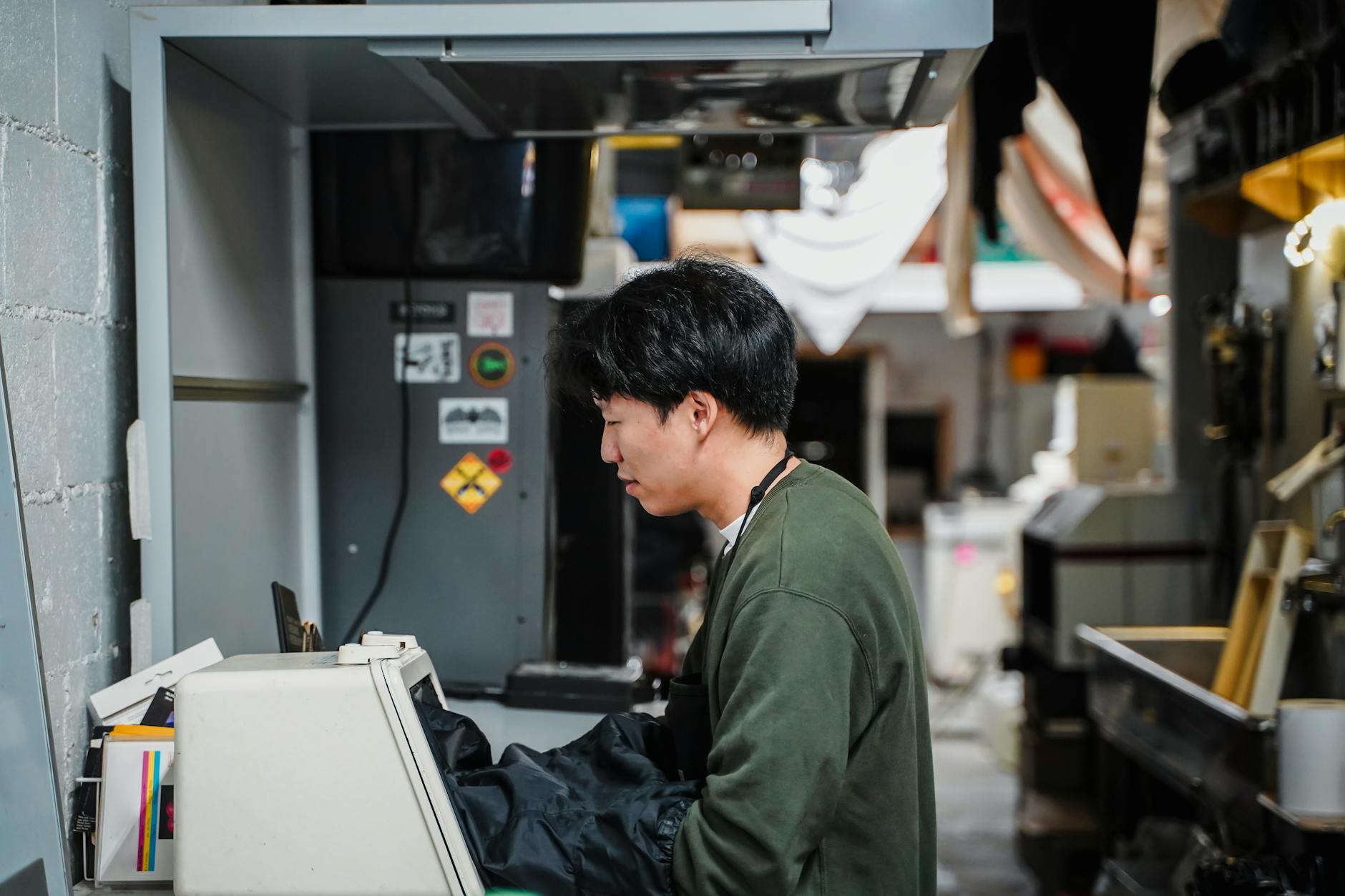 A picture of a researcher working with OoC devices