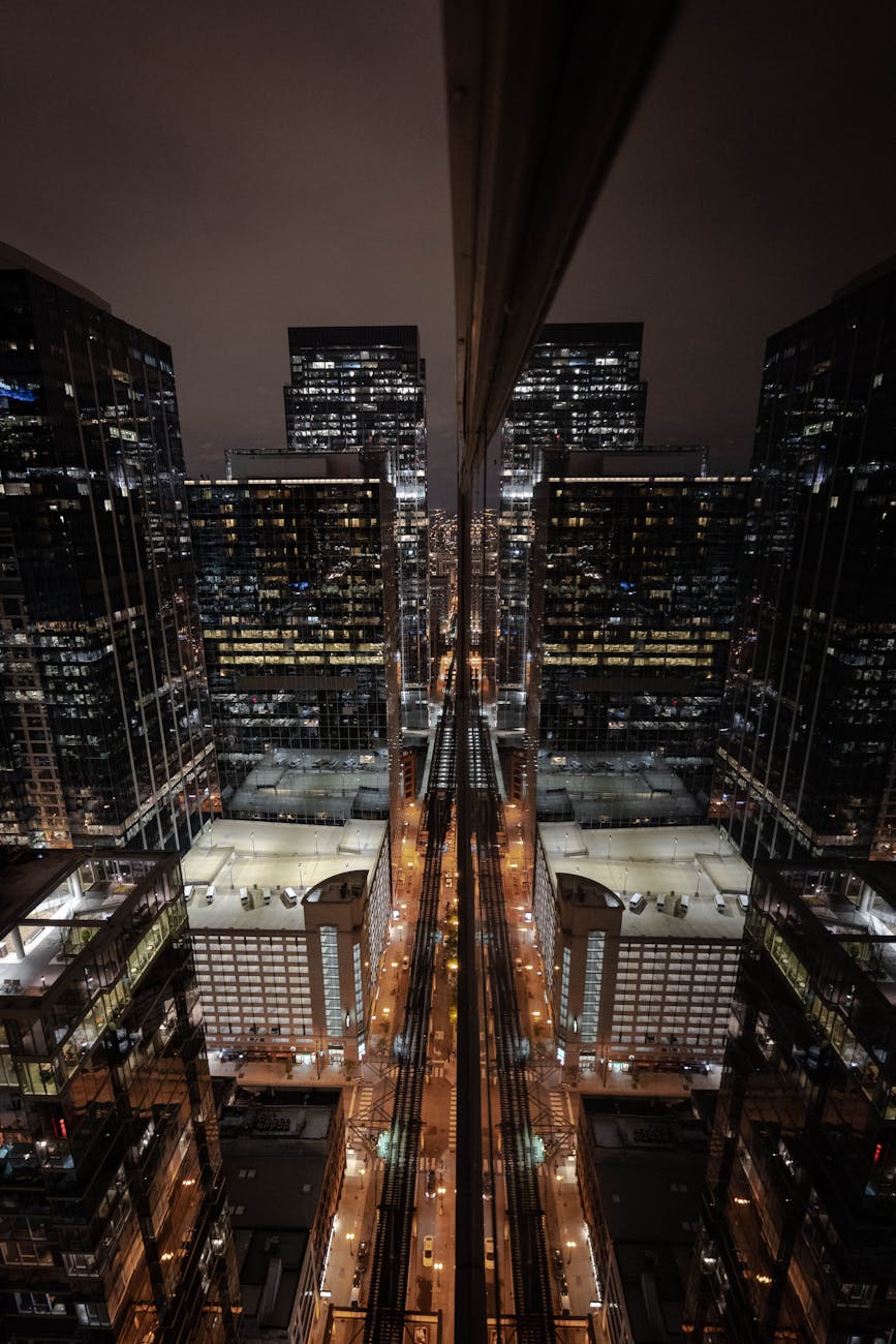 A cityscape at night, with buildings and streets managed by digital twin technology