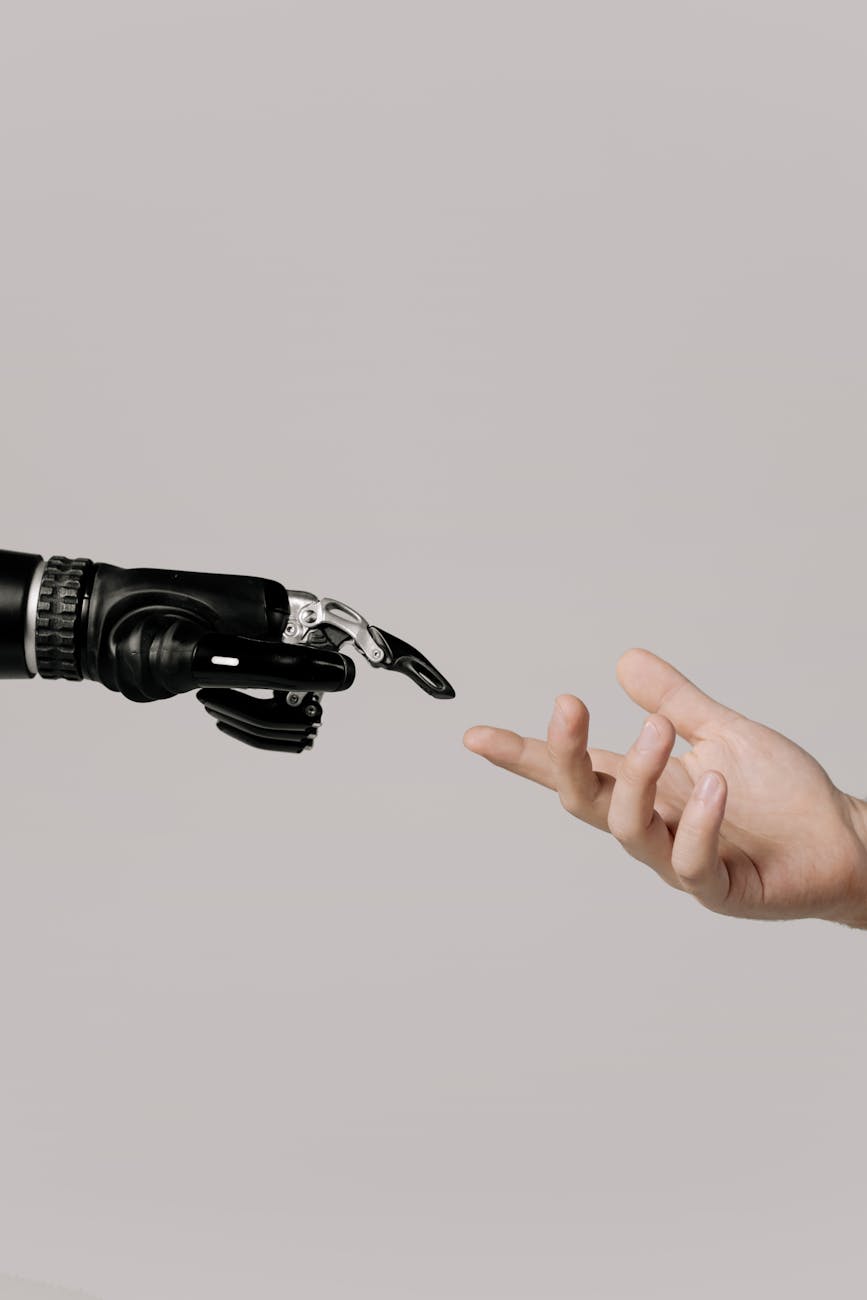 A close-up of a human hand interacting with a holographic digital twin interface, symbolizing human-AI collaboration in industrial management.