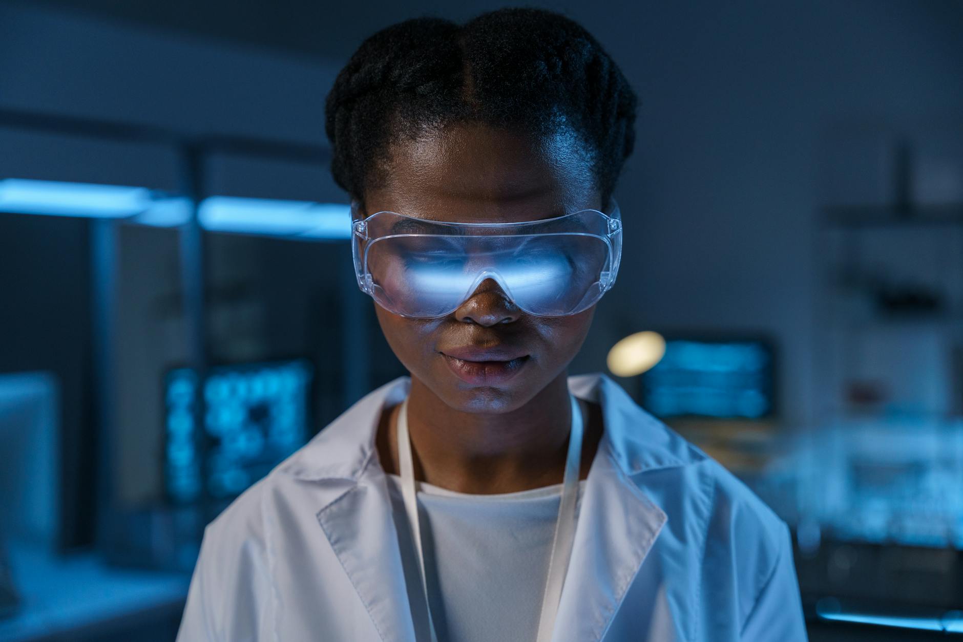 A high-tech laboratory setting with scientists in futuristic attire examining glowing cellular structures under advanced microscopes, symbolizing the cutting edge of biological research.