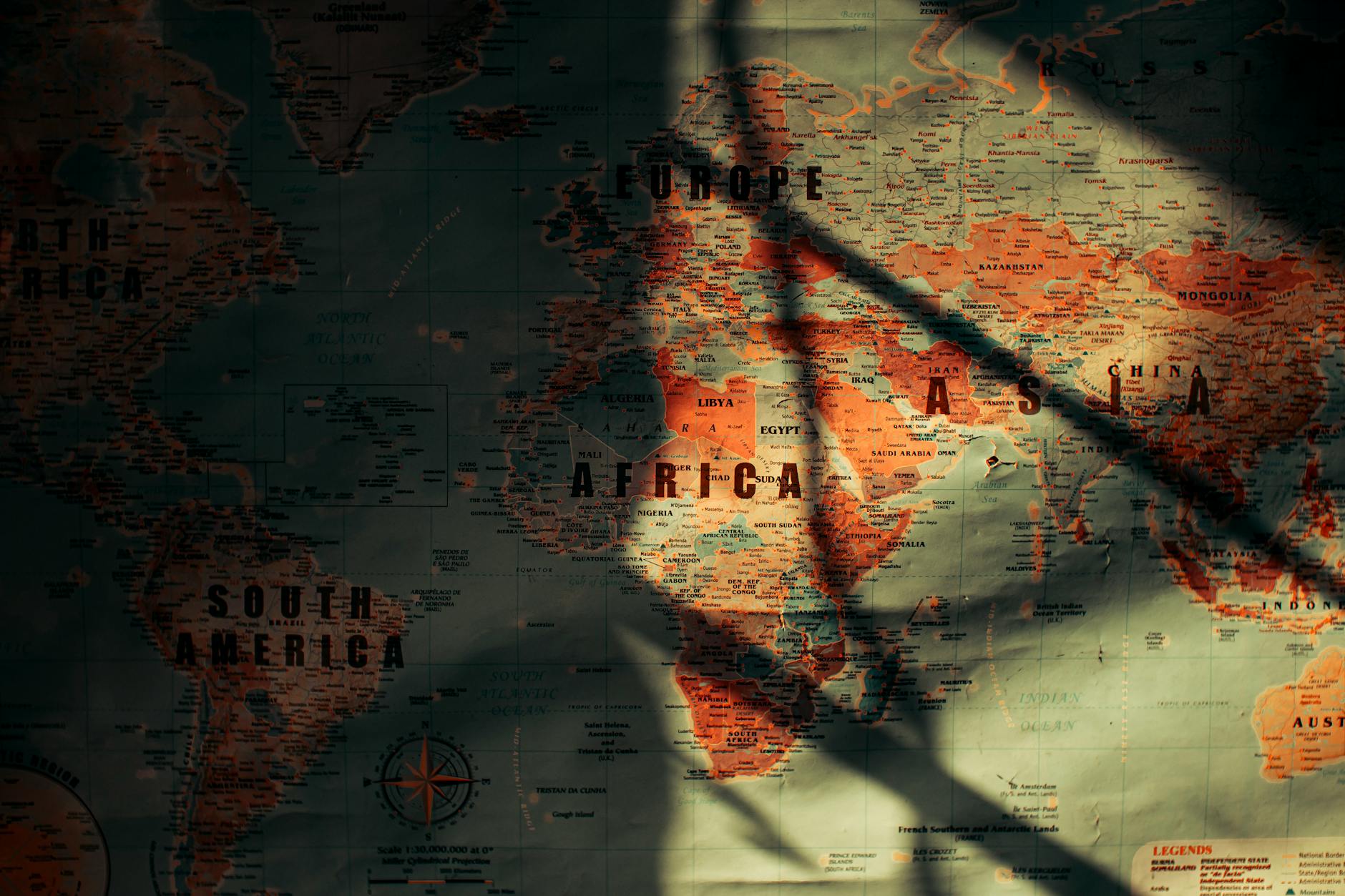 A stylized world map with glowing lines representing energy transmission routes from multiple orbital SBSP stations to various continents, symbolizing global energy connectivity.