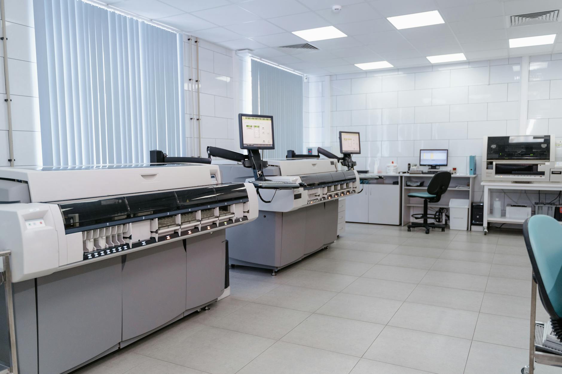 Researchers collaborating in a high-tech lab, surrounded by digital displays showing genomic data and AI algorithms.