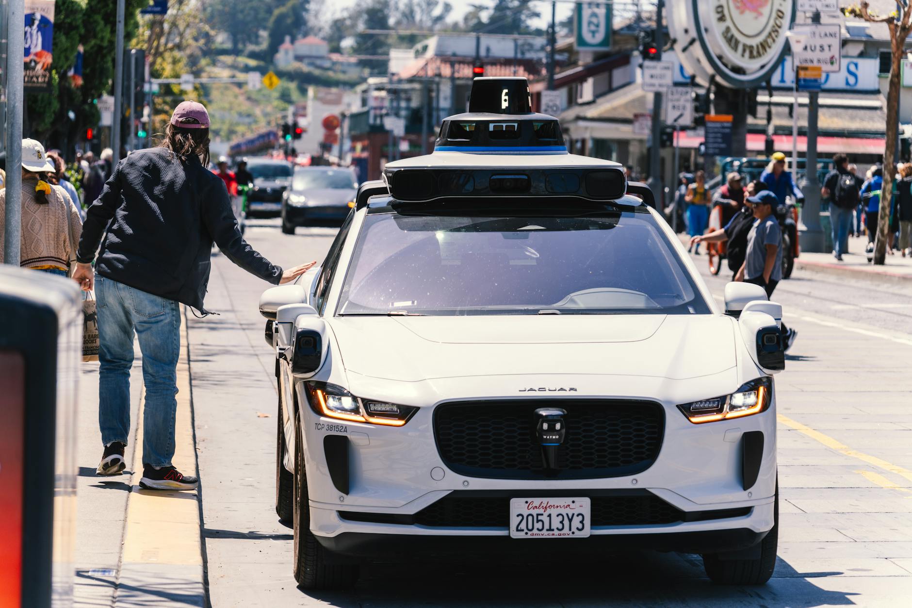 A futuristic, sleek autonomous vehicle navigating a complex urban intersection with an overlay of glowing AI data streams, symbolizing advanced perception and decision-making.