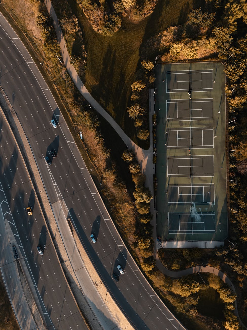 A split image showing the complexity of urban ground traffic on one side and a serene, futuristic highway with autonomous vehicles on the other, highlighting the range of operational domains.