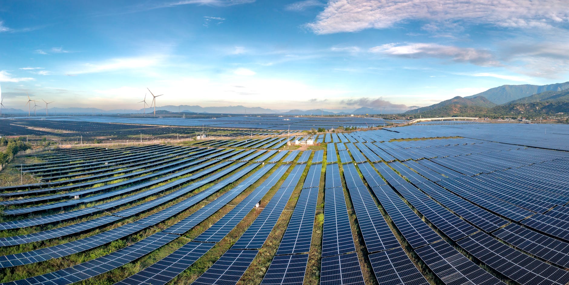A futuristic, glowing energy grid overlaying a global map, with distinct lines flowing from solar panels and wind turbines into large, mysterious storage facilities, representing grid-scale LDES.