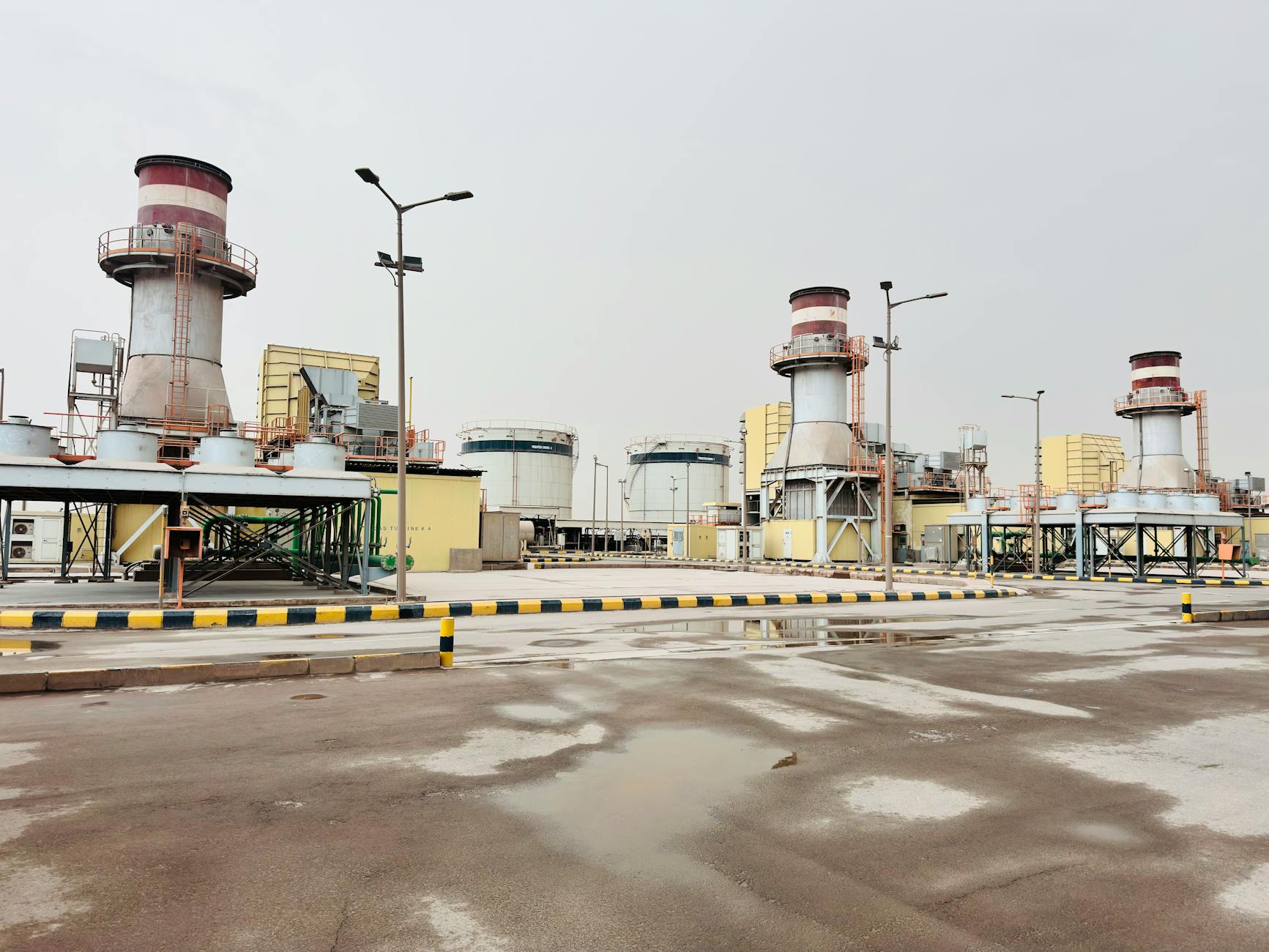 A montage of diverse industrial settings (power plant, factory, autonomous vehicle) seamlessly integrated with digital security elements.