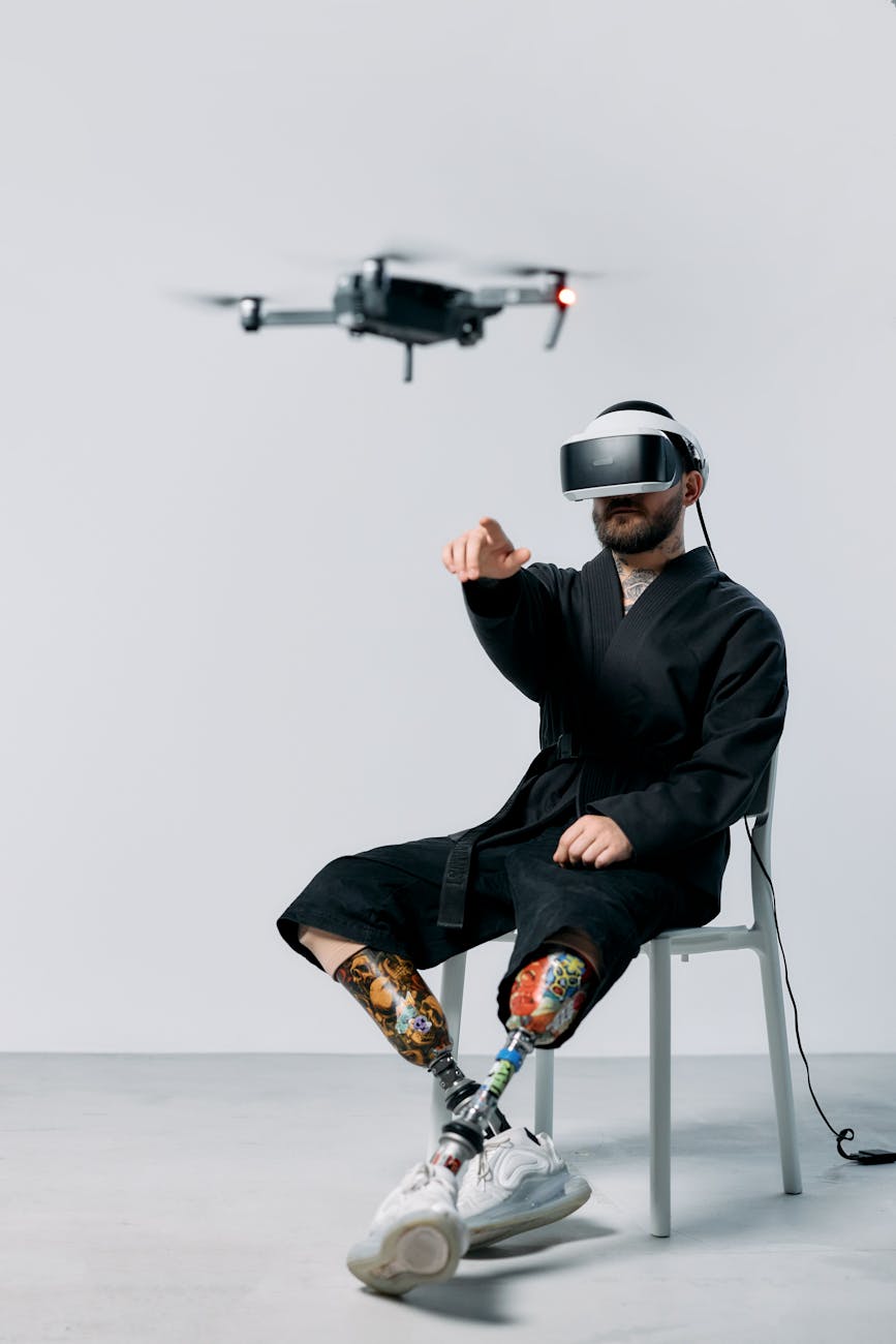 A split image showing on one side, a group of humans collaborating with robots in a modern workspace, and on the other side, a person attending a virtual reality training session for robot operation.