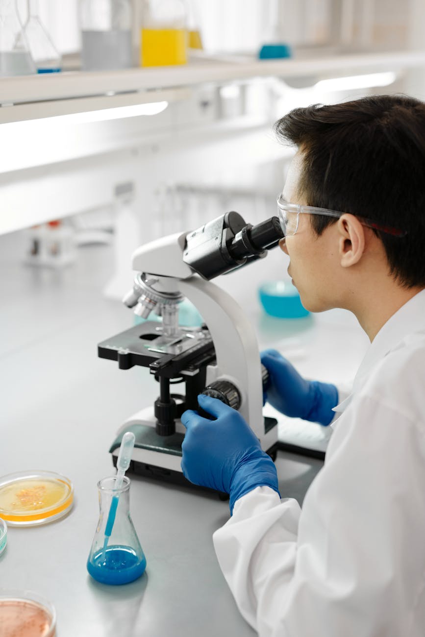 Microscopic AI-powered nanobots navigating through a human bloodstream, targeting diseased cells with glowing precision, representing the Quantum Aegis in action.