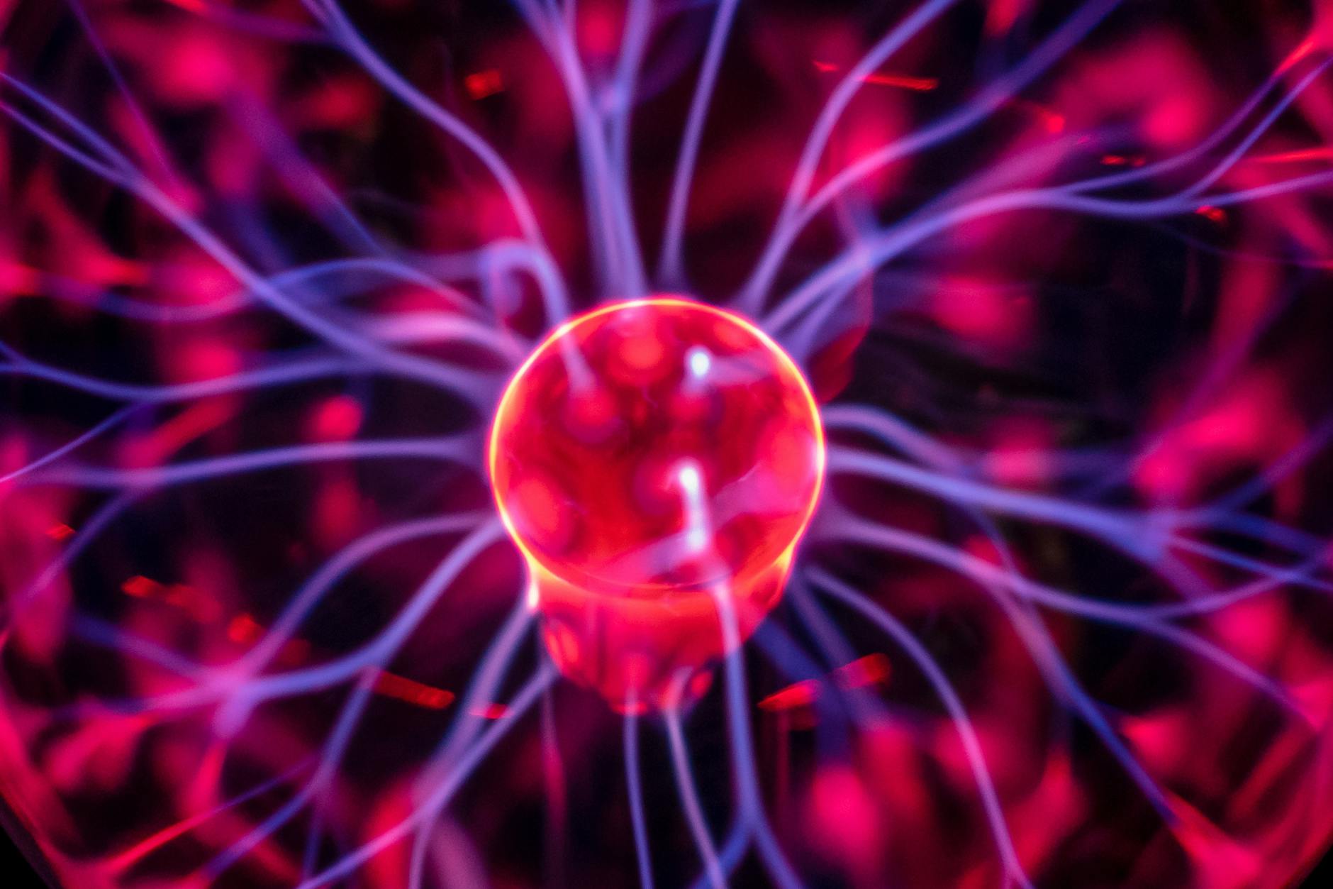 A mesmerizing, futuristic depiction of a plasma confinement within a tokamak reactor, glowing with intense, controlled energy, against a backdrop of swirling cosmic dust.