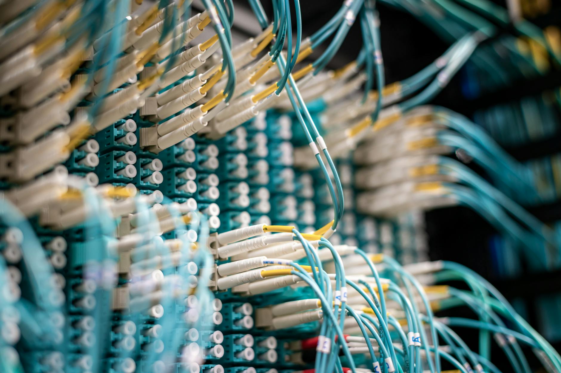 A sprawling network of fiber optic cables and 5G antennas crisscrossing a futuristic landscape, symbolizing the advanced communication infrastructure required for VPPs and DER integration. The image should convey speed and interconnectedness.