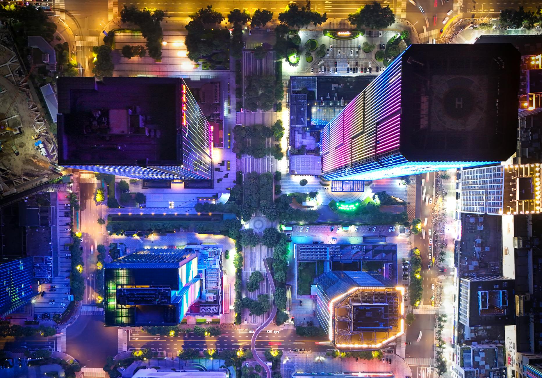 A sleek, multi-rotor eVTOL aircraft hovering silently above a futuristic urban skyport, bathed in the soft glow of city lights. The design emphasizes efficiency and quiet operation.