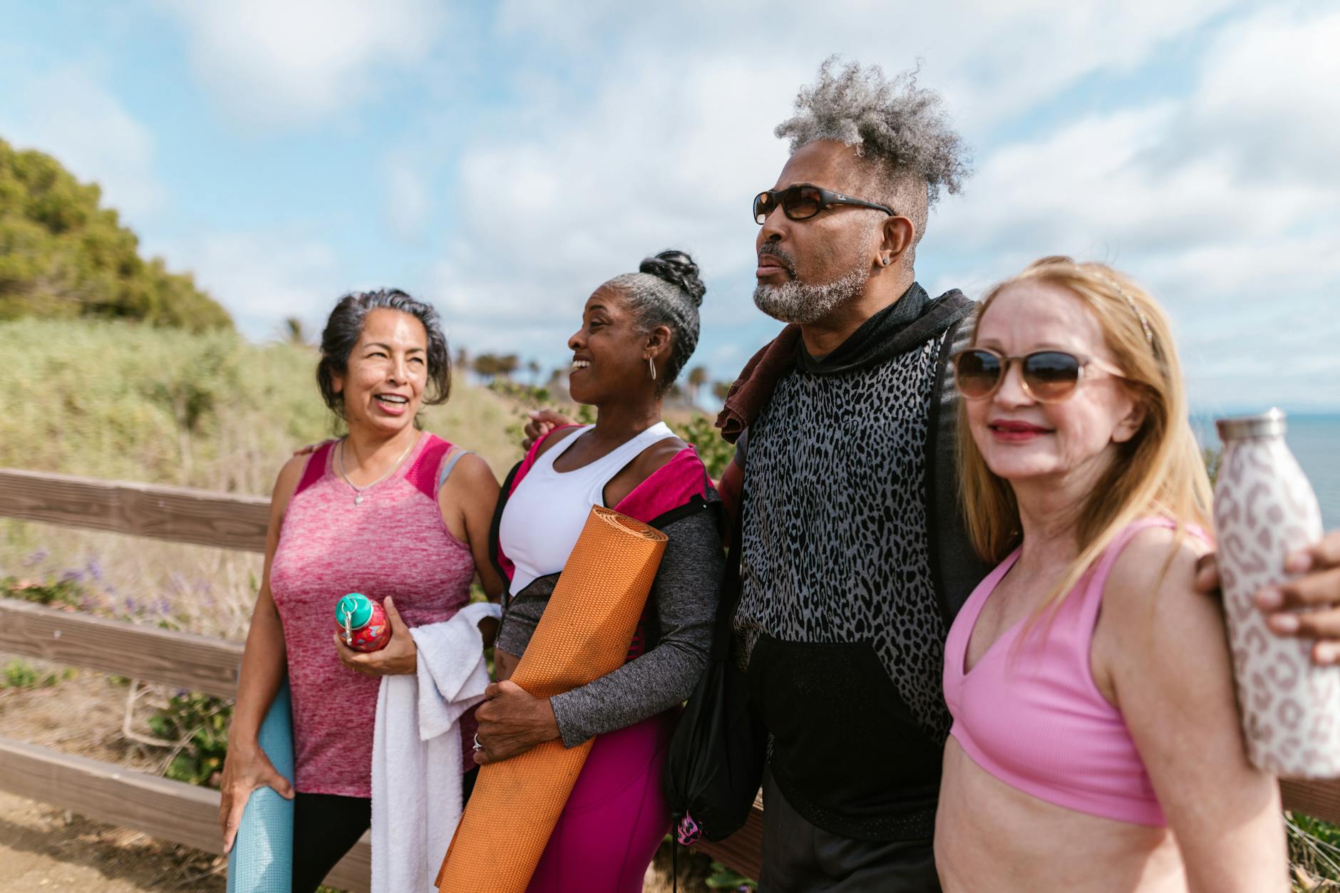 A diverse group of healthy, active elderly individuals engaged in various activities, representing the successful extension of human healthspan.