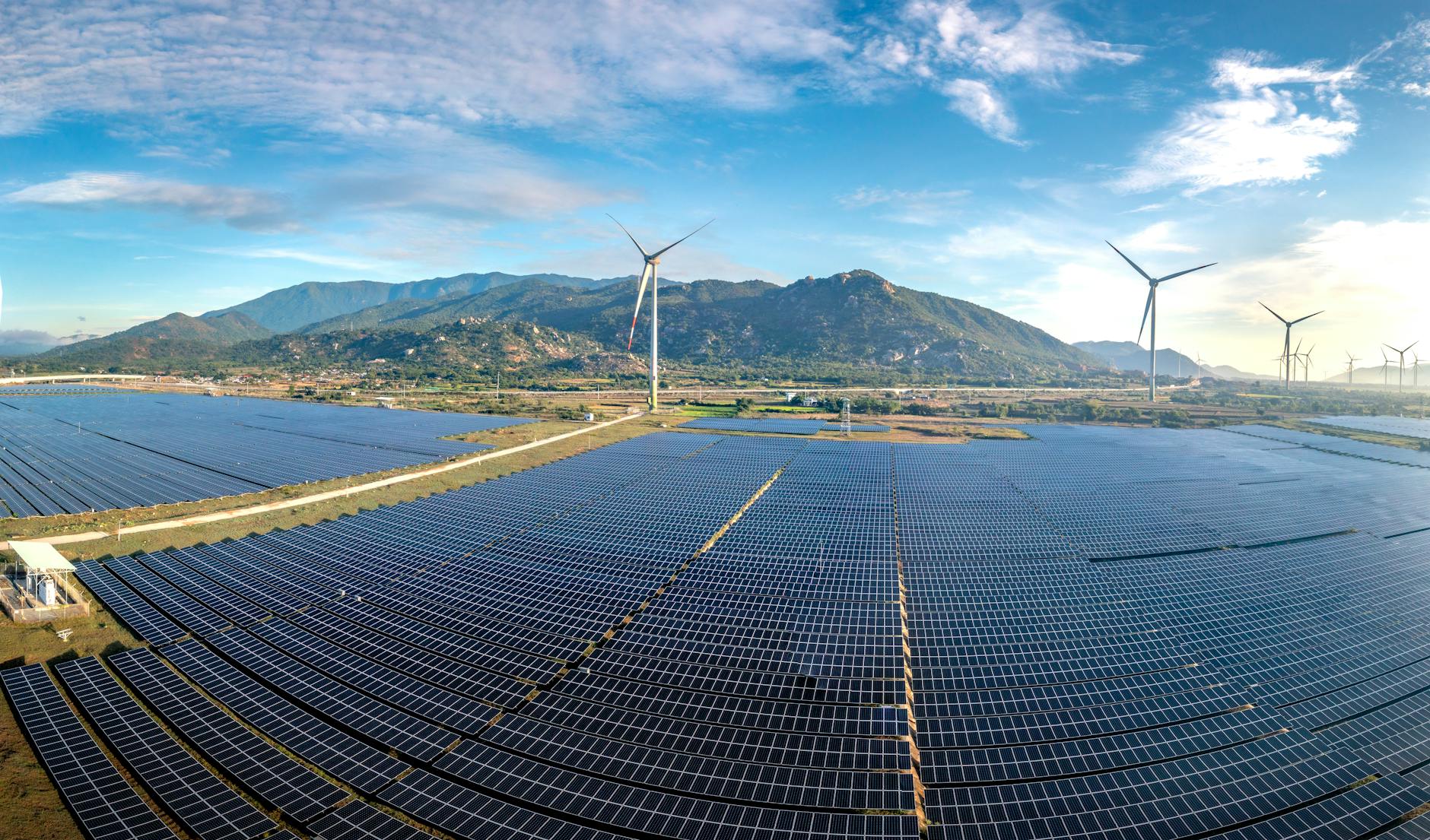 A panoramic view of a future city skyline powered by clean energy, with subtle visual cues of SMRs integrated into the urban or industrial landscape, symbolizing progress and sustainability.