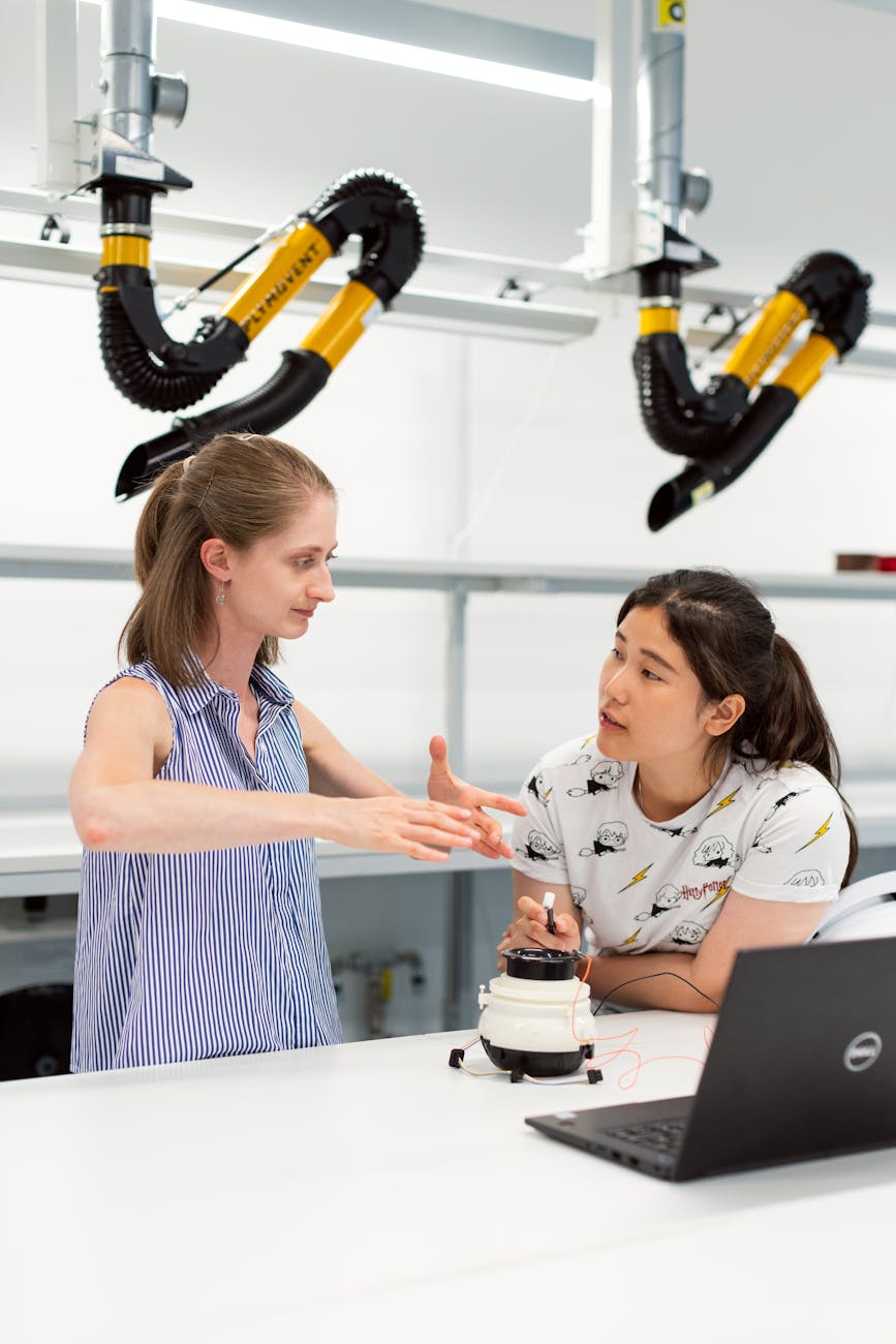 A diverse team of scientists and engineers collaborating around a holographic display showing a complex AI model for lunar resource extraction.