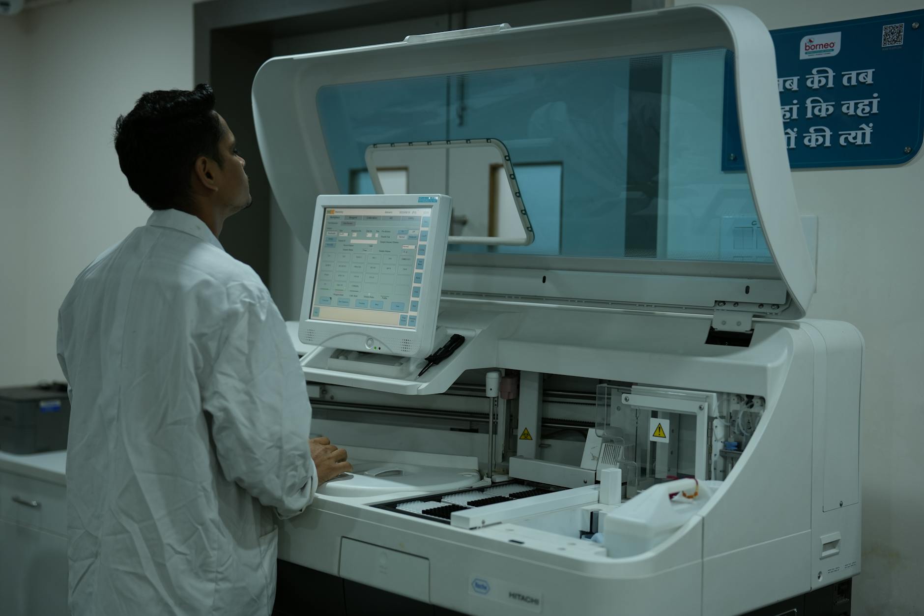 A laboratory setting with scientists analyzing data from screens displaying molecular simulations on digital human twin models.