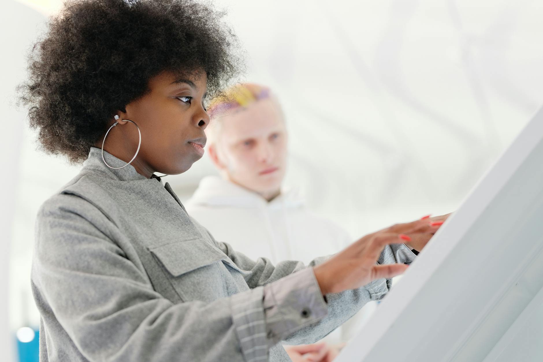 A diverse group of individuals engaging with a futuristic health interface, showcasing personalized wellness dashboards and recommendations.